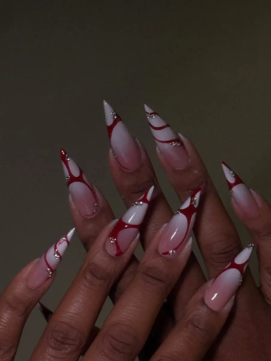 Chic stiletto nails with red marble design
