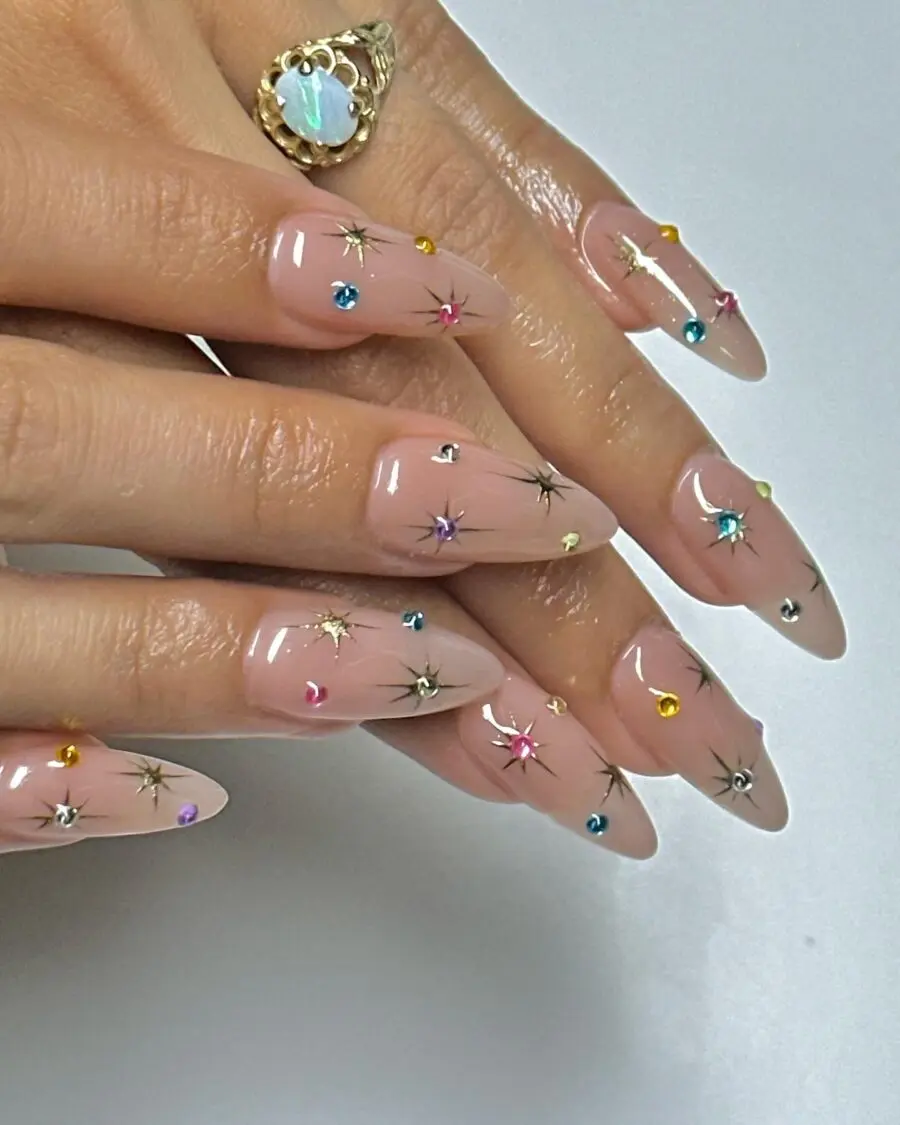 Glamorous stiletto nails adorned with starry gems