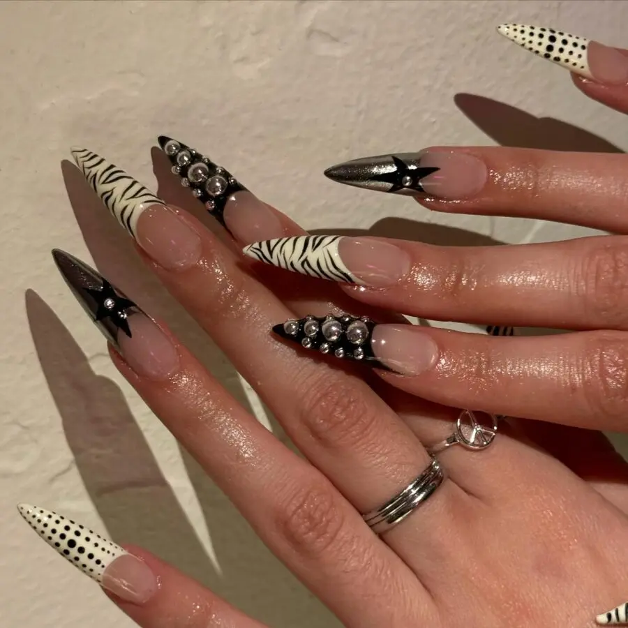 Edgy stiletto nails with black and white design