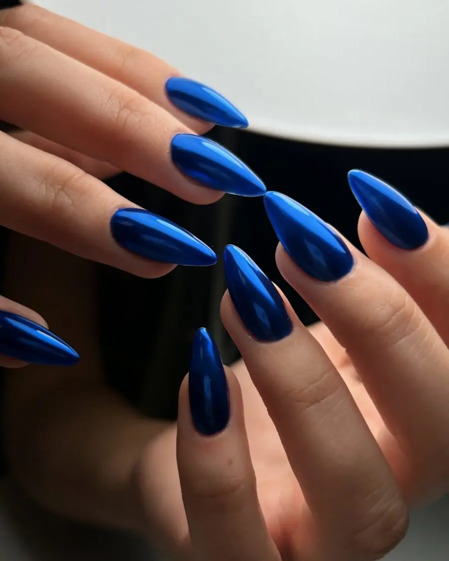 Stunning vibrant blue stiletto nails on display