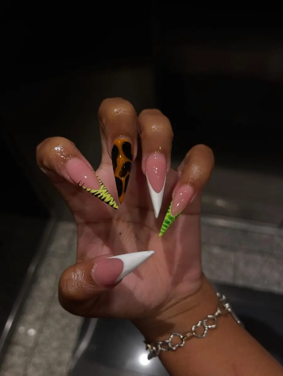 Vibrant stiletto nails with playful patterns