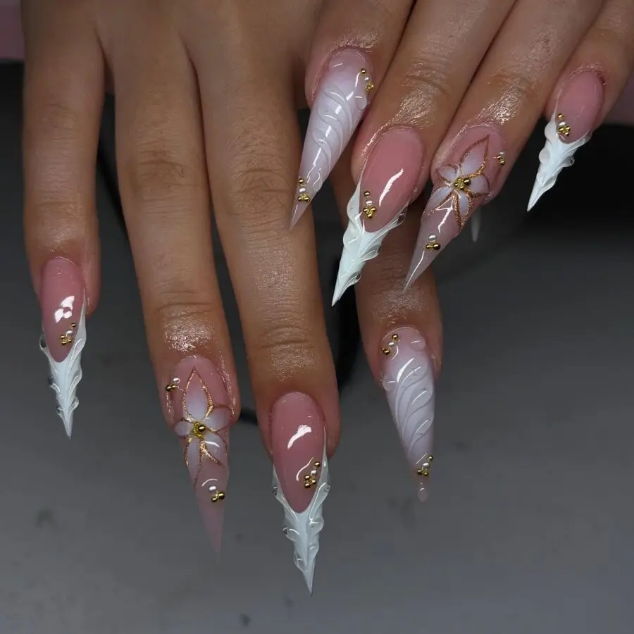 Elegant stiletto nails with floral embellishments