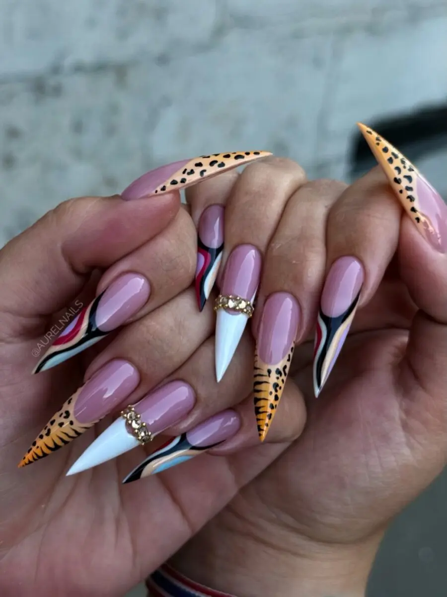 Vibrant stiletto nails with playful patterns