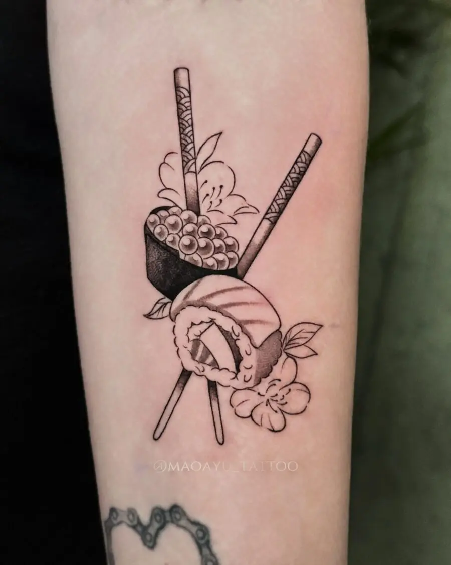 Elegant sushi tattoo with chopsticks and flowers