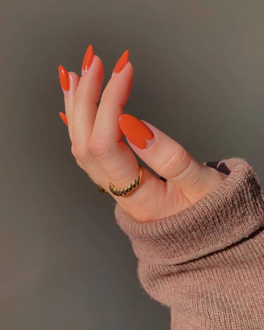 Vibrant orange glossy Thanksgiving nail design