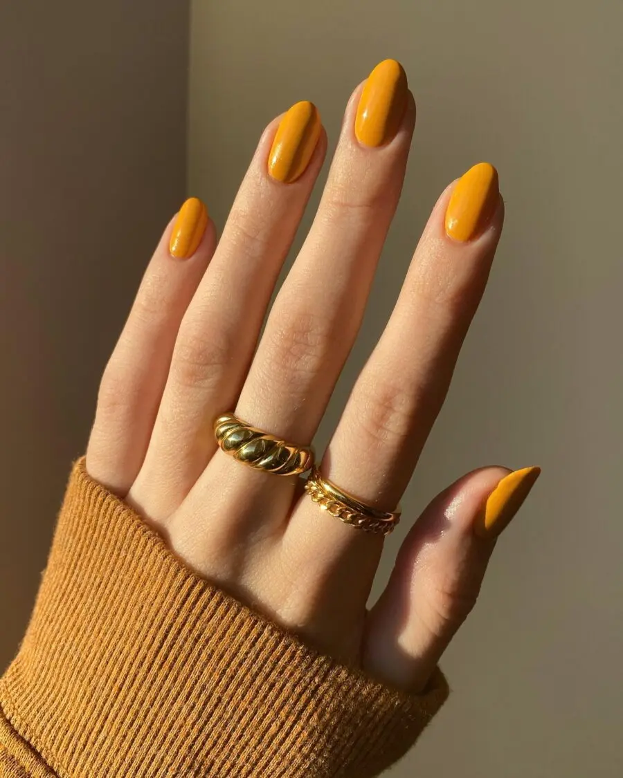 Vibrant yellow nails for a cozy Thanksgiving vibe