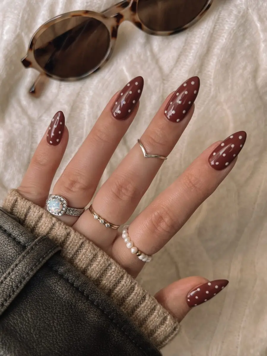 Chic burgundy nails with playful polka dots