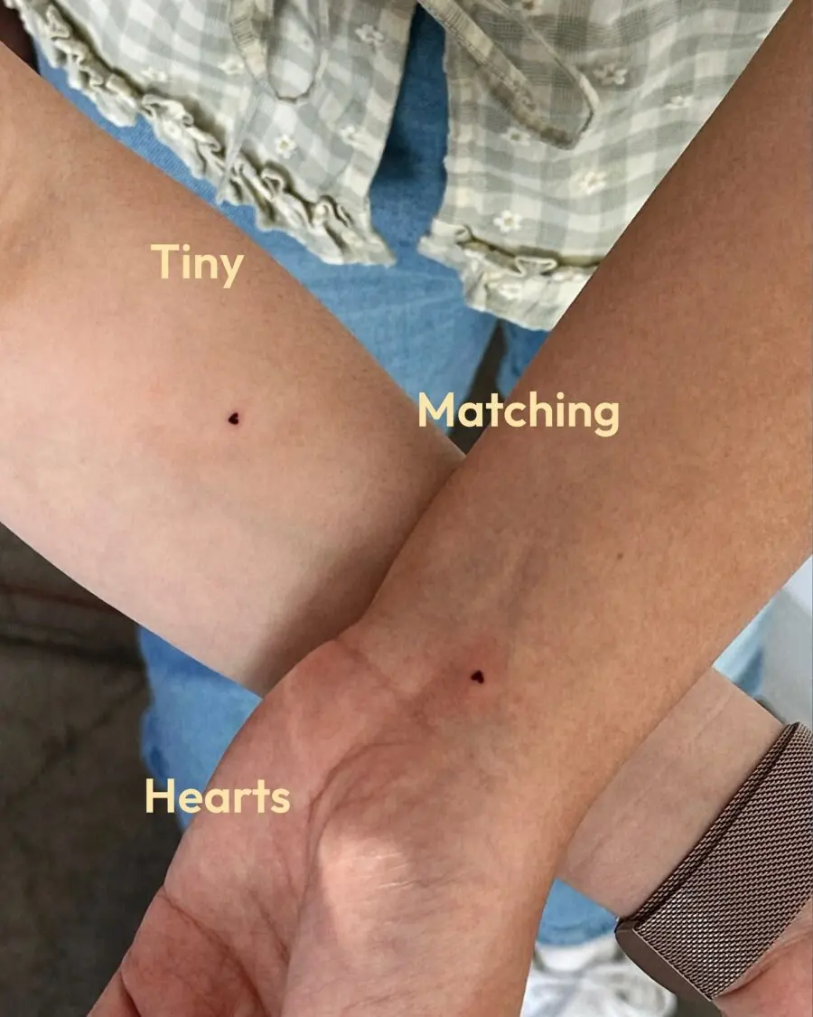 Delicate matching heart tattoos for friends