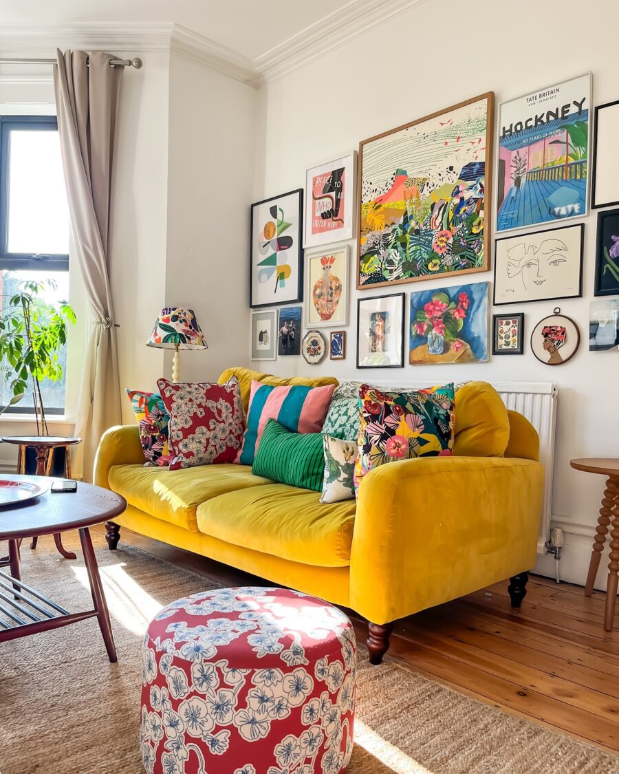 Vibrant yellow sofa with artful wall display
