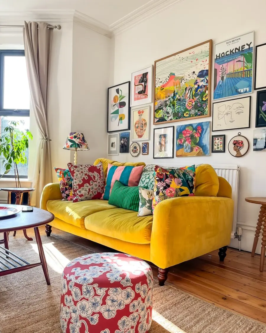 Vibrant yellow sofa with artful wall display