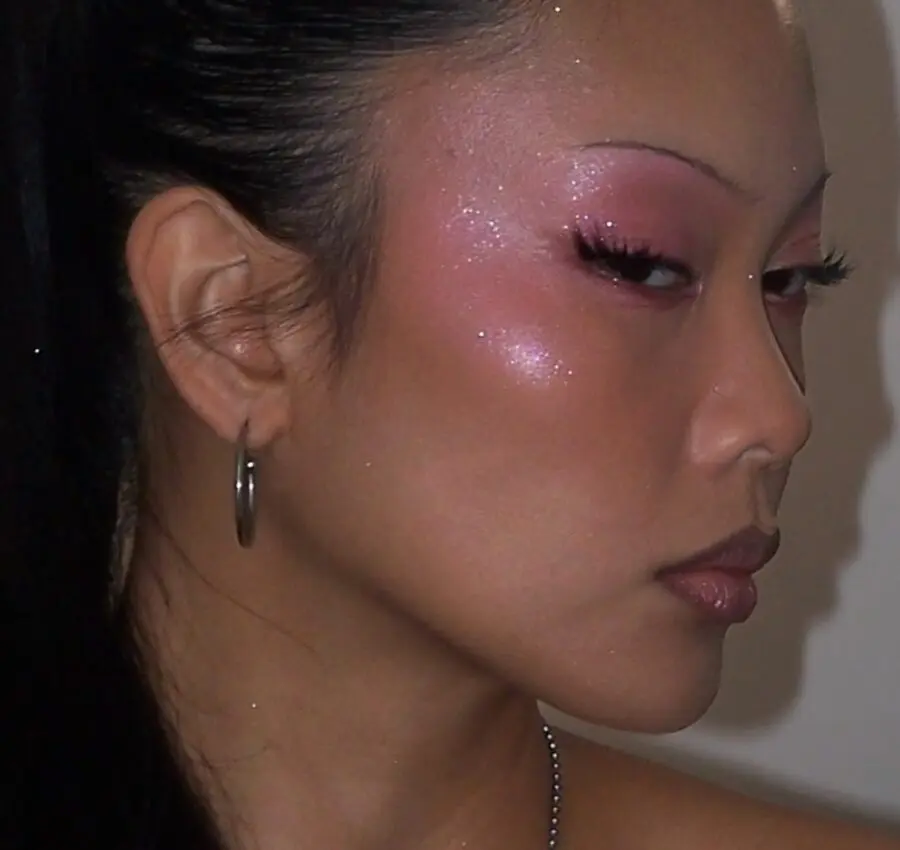 Glittery pink Y2K-inspired makeup vibes.