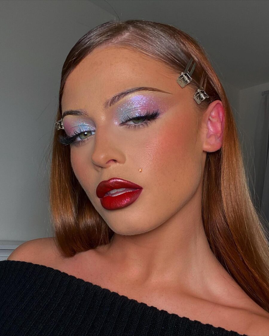 Bold red lips and shimmering pastel eyes