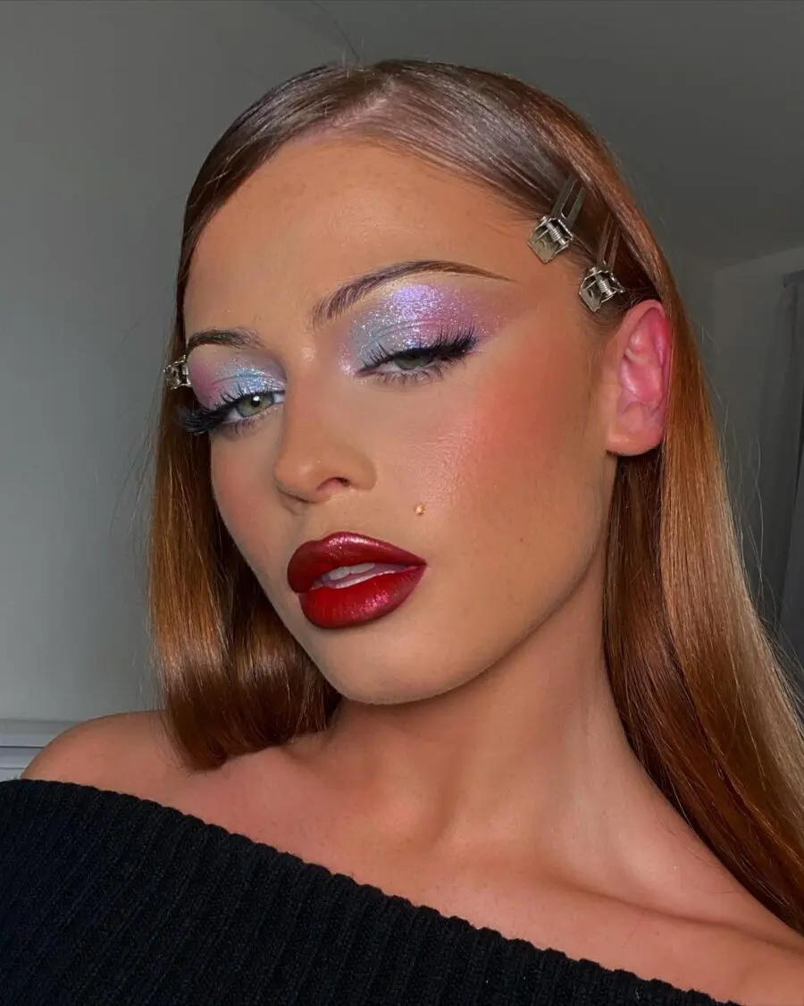 Bold red lips and shimmering pastel eyes