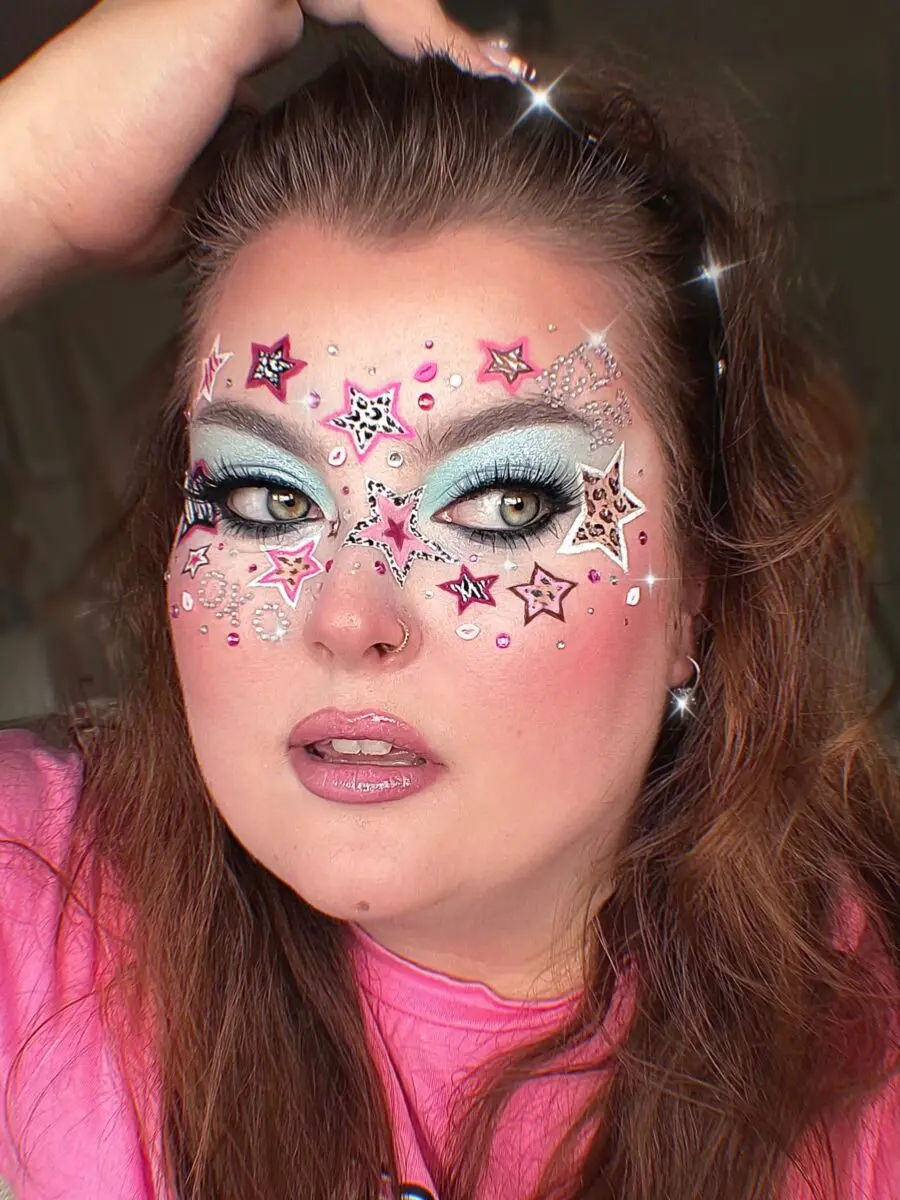 Vibrant y2k-inspired starry glitter makeup style