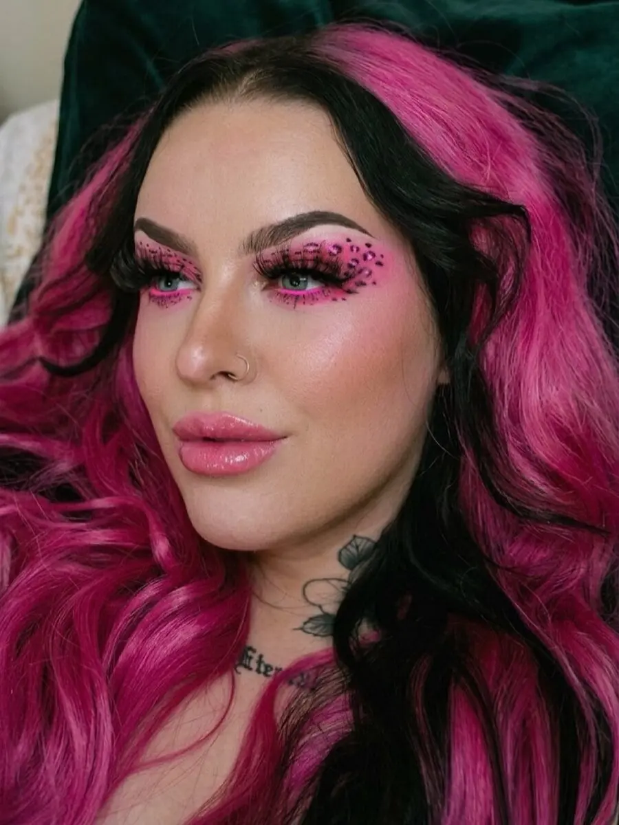 Bold y2k makeup with pink leopard details