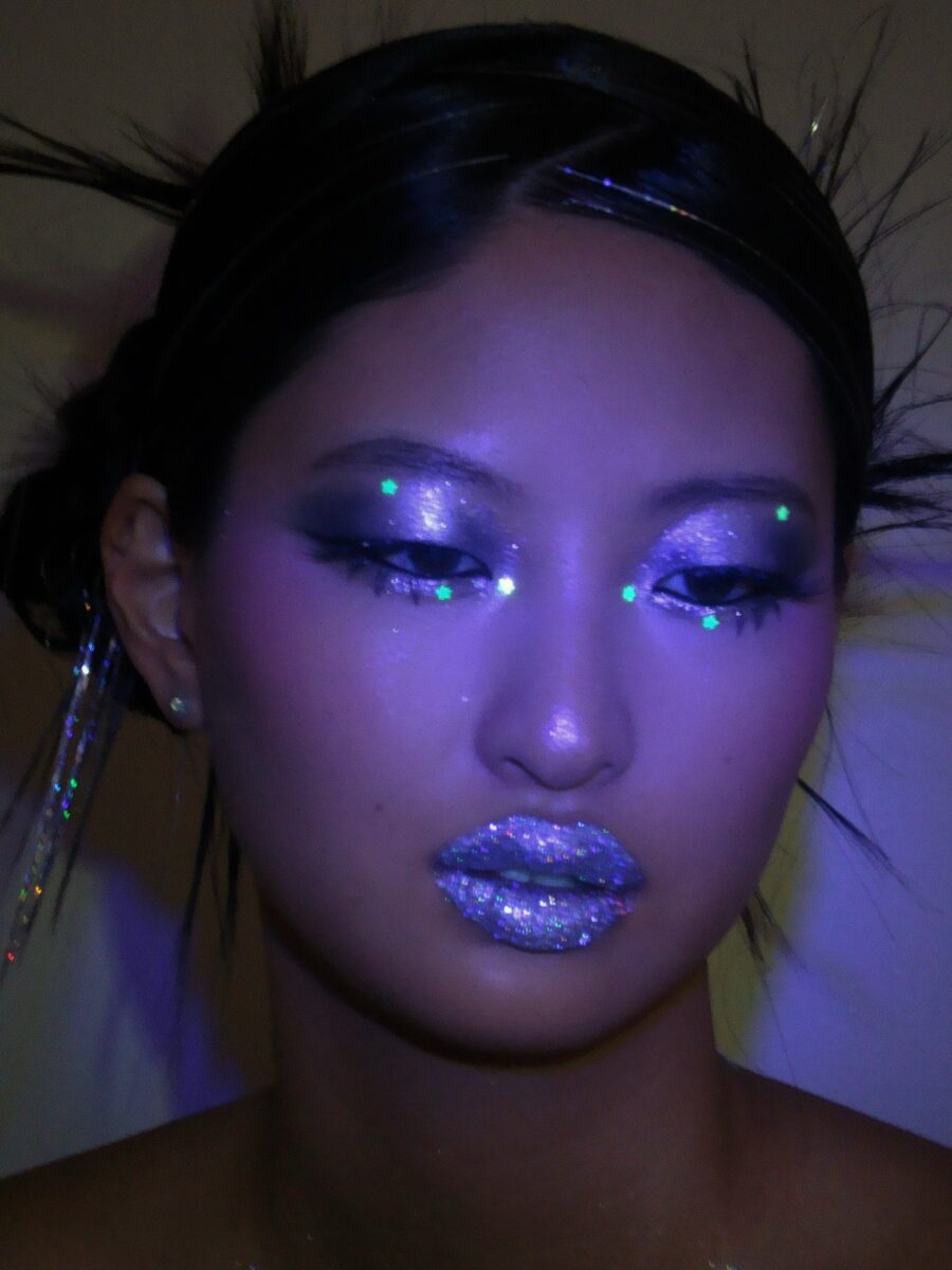 Futuristic and sparkly Y2K-inspired makeup look